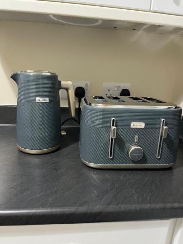 two toasters sitting on top of a counter at Lovely 2 bedrooms apartment in Portsmouth
