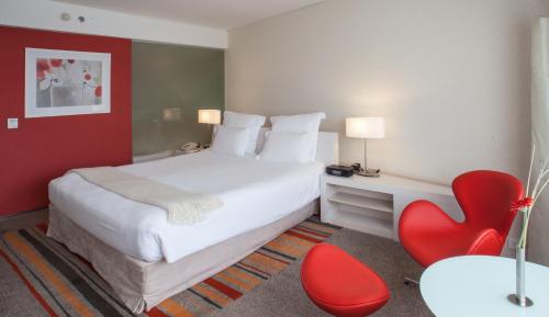 Кровать или кровати в номере Hotel Casino Pullman City Center Rosario