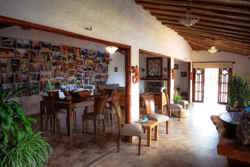 a dining room with a table and chairs at Hotel Boutique Santa Clara Mesa de los Santos in Los Santos