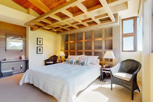 a bedroom with a bed and a table and chairs at Gustafson Vineyard Retreat in Geyserville
