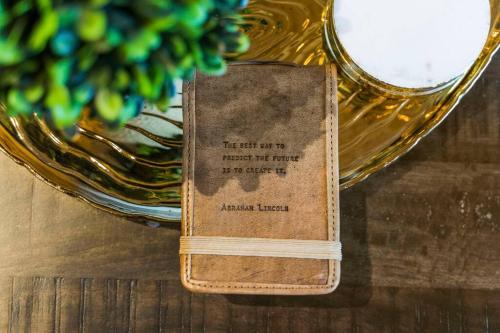 a book sitting on top of a table next to a bowl at Tahoe Bliss: Ski, Hike, & Relax in Incline Village
