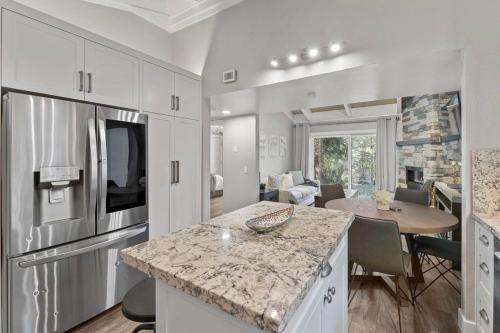 a kitchen and living room with a counter and a table at Tahoe Bliss: Ski, Hike, & Relax in Incline Village