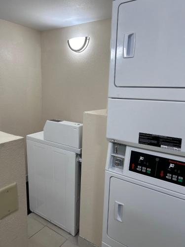 a kitchen with white appliances in a room at Red Roof Inn Richmond, IN in Richmond