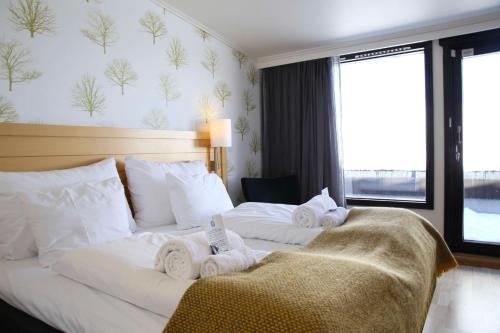 Кровать или кровати в номере Voksenasen Hotell; Best Western Signature Collection