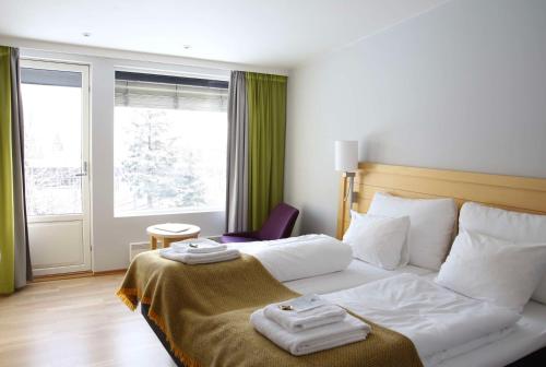Кровать или кровати в номере Voksenasen Hotell; Best Western Signature Collection