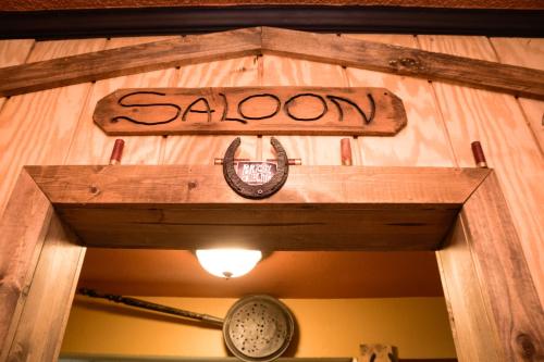a sign for a sa clan hanging on a wall at The Chadwick in San Diego