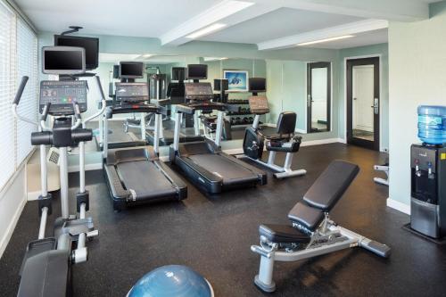 a gym with several treadmills and cardio machines at Holiday Inn Weirton-Steubenville Area in Weirton
