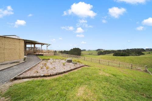 a house with a garden in the middle of a field at Apartment 3 in Auckland