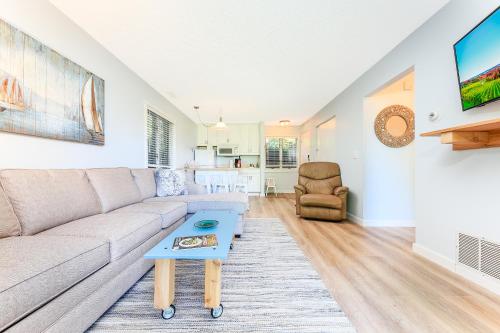 a living room with a couch and a table at The Shores in Williamsburg