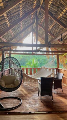 a hammock in a room with a hammock at Bayano Ecolodge in Chepo