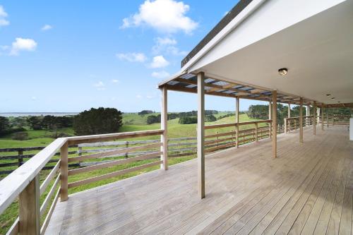 a large deck with a view of the countryside at Apartment 4 in Auckland