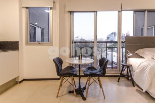 Ein Bett oder Betten in einem Zimmer der Unterkunft Wonderful Studio In The City, Close To Sh Del Sol