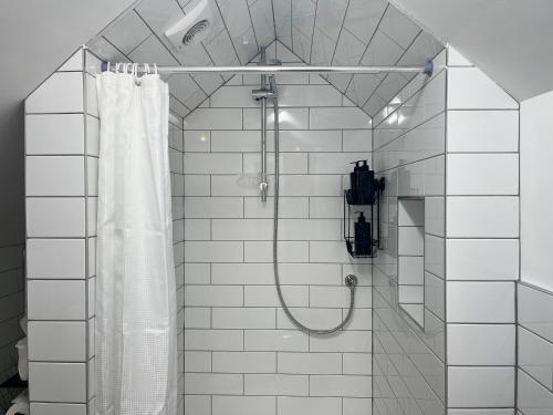 a bathroom with a shower with a shower curtain at Doves Nest in Ashbourne