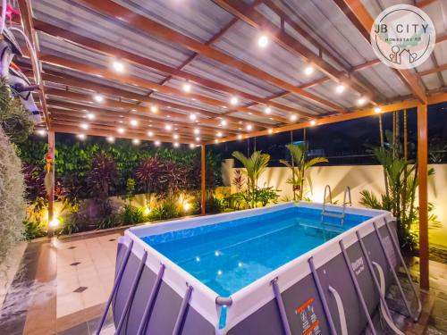 a hot tub in a patio with plants at JB Town Villa by JBcity Home in Johor Bahru