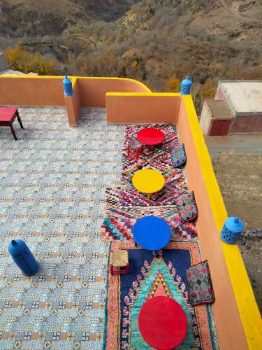 a play area with a table and a box at Riad imNane Lodge in Tamguist