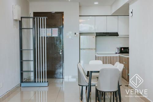 a kitchen and dining room with a table and chairs at Ipoh Majestic Premium Suites by Verve in Ipoh