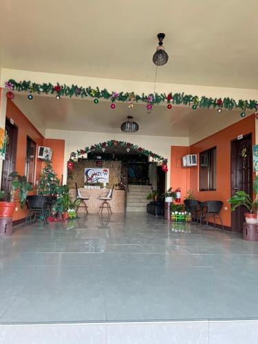 an empty lobby with christmas decorations and a large room at C View Resort in Sipalay