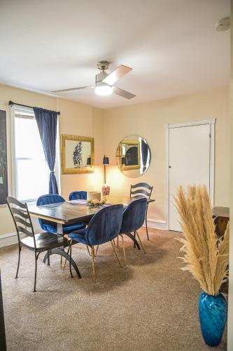a dining room with a table and chairs at Chic 4BR Dwelling with Backyard in Philadelphia in Philadelphia