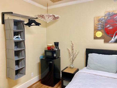 a bedroom with a bed and a book shelf at The Chadwick in San Diego