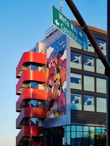 a building with a mural on the side of it at citizenM Menlo Park in Menlo Park