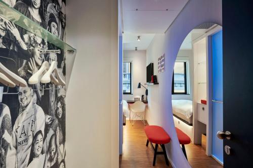 a room with a staircase leading to a bedroom at citizenM Rome Isola Tiberina in Rome