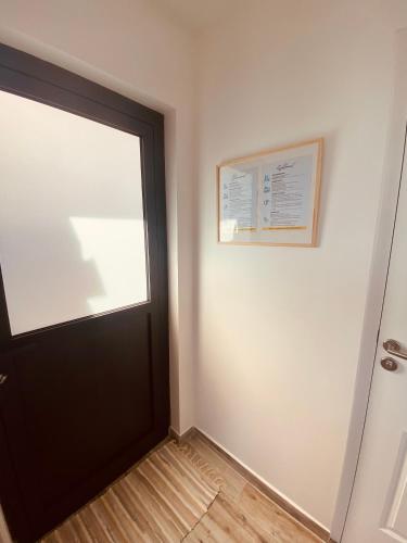 a room with a door and a picture on the wall at Villa Ranitea in Avae