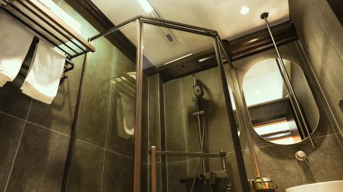 Ein Badezimmer in der Unterkunft Yangzhou Aihehua Boutique Homestay
