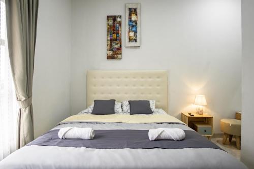 Katil atau katil-katil dalam bilik di Bisma Balcony Homestay