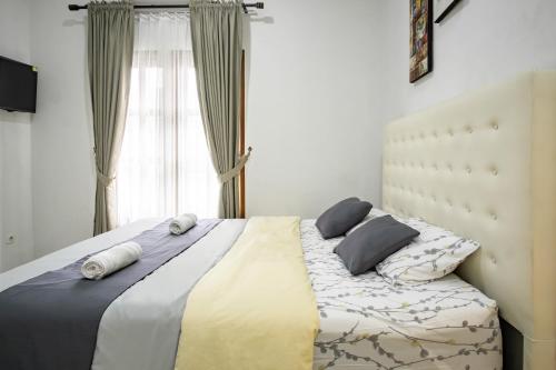 Katil atau katil-katil dalam bilik di Bisma Balcony Homestay