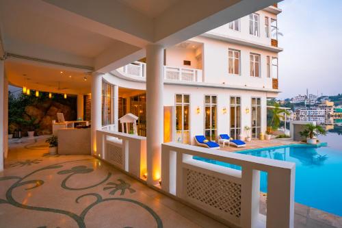 a view of a house with a swimming pool at Moustache Udaipur Verandah in Udaipur