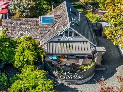 an overhead view of a house with a sign on it at Manna House in Denman Island