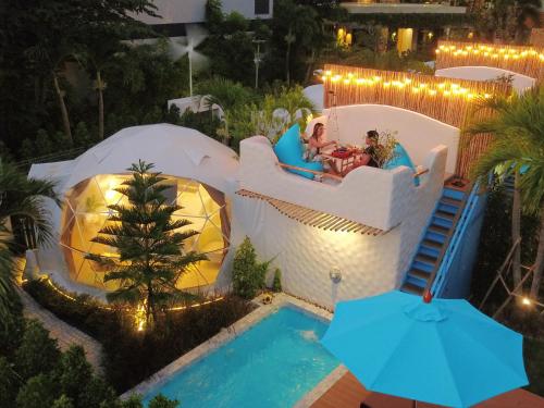 an aerial view of a water slide at a resort at Le Resort and Villas in Rawai Beach