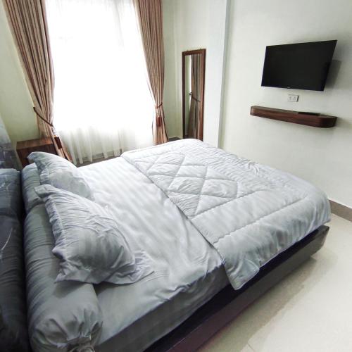 Postel nebo postele na pokoji v ubytování Kala Guest House