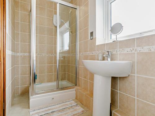 a bathroom with a shower and a sink at 1 Bed in Sennen GIDUP in St Just