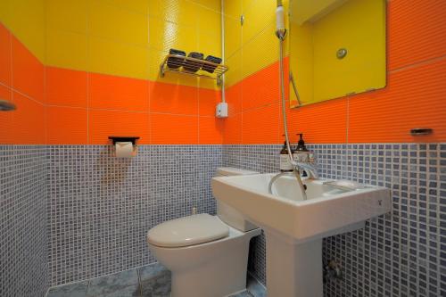 a bathroom with a toilet and a sink at Soo Guest House in Seoul
