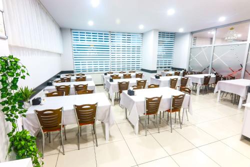 a dining room with white tables and chairs at Diera Family Hotel in Atakum