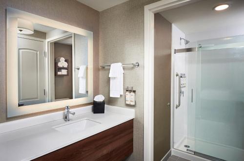 a bathroom with a sink and a shower at Staybridge Suites Niagara-On-The-Lake, an IHG Hotel in Niagara on the Lake