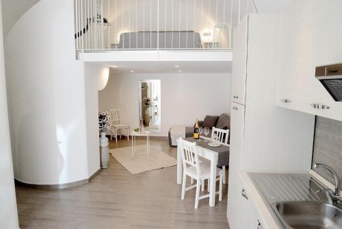 a kitchen and a living room with a dining room at Donna Anna in Polignano a Mare