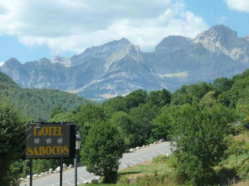 a road with a sign that reads hotel saago at Hotel Sabocos in Panticosa
