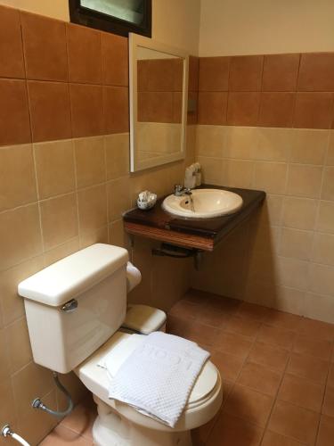 a bathroom with a toilet and a sink at Suan Bankrut Beach Resort in Ban Krut