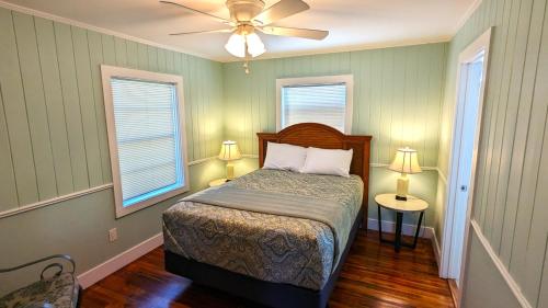 a bedroom with a bed and a ceiling fan at 213 Ohio in Fort Myers Beach