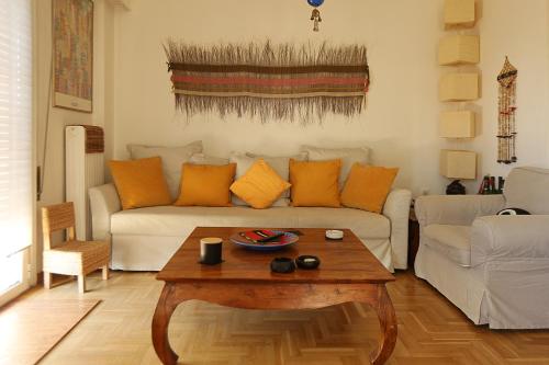 a living room with a couch and a coffee table at Nest in Mets in Athens