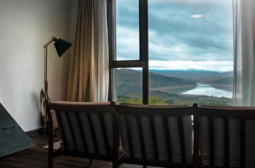 a room with a window with a view of a lake at Casa Boumort in Sant Marti de Canals