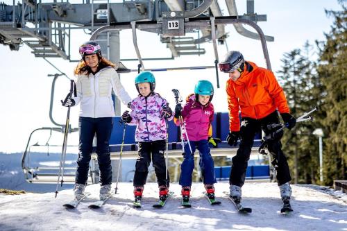 a group of people on a ski lift at KORZO LIPNO C in Lipno nad Vltavou