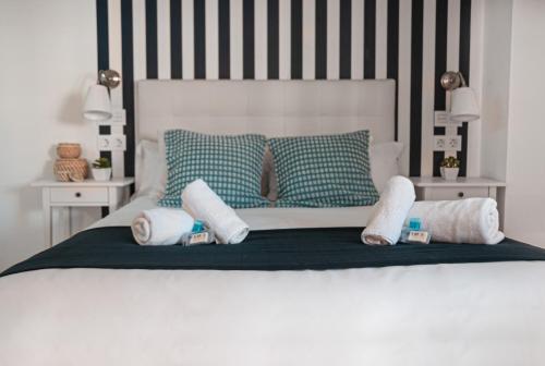 Posteľ alebo postele v izbe v ubytovaní Larios Premium Apartments