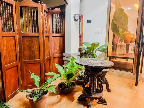 a room with a table and some plants at Anahaw Estates Davao in Davao City