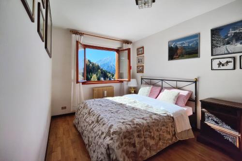 En eller flere senge i et værelse på - La Casetta di Legno - i colori della natura