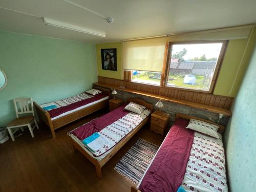 Postel nebo postele na pokoji v ubytování Beneport Peipsi Guest House