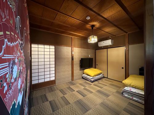 Postel nebo postele na pokoji v ubytování ビーチハウス沼津Beach house numazu ビーチ至近