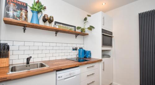 a kitchen with a sink and a counter at The Cranny 2 Bed House in Central Morpeth in Morpeth